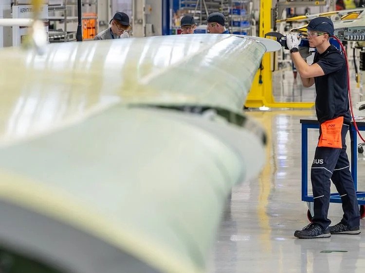 Workers on the A321 wing production line at Airbus Broughton